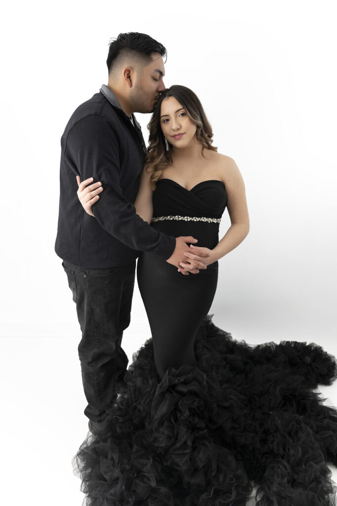 Pair in formal attire, pose for their maternity session.